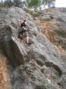 The author rock climbing