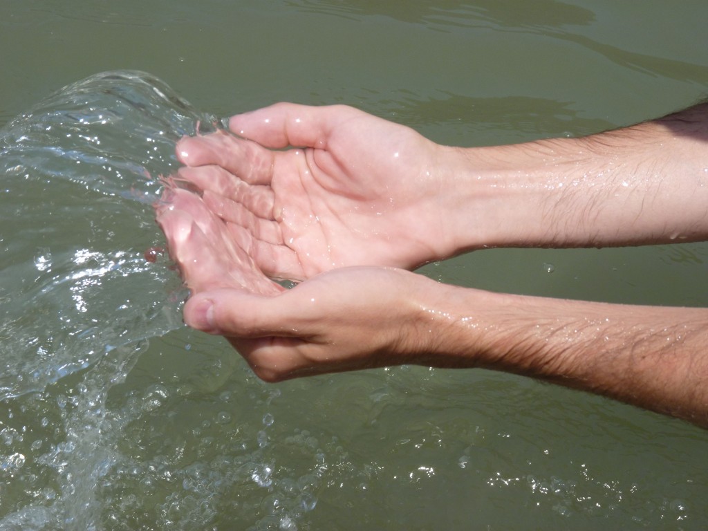 Hands in the Ganges in Rishikesh